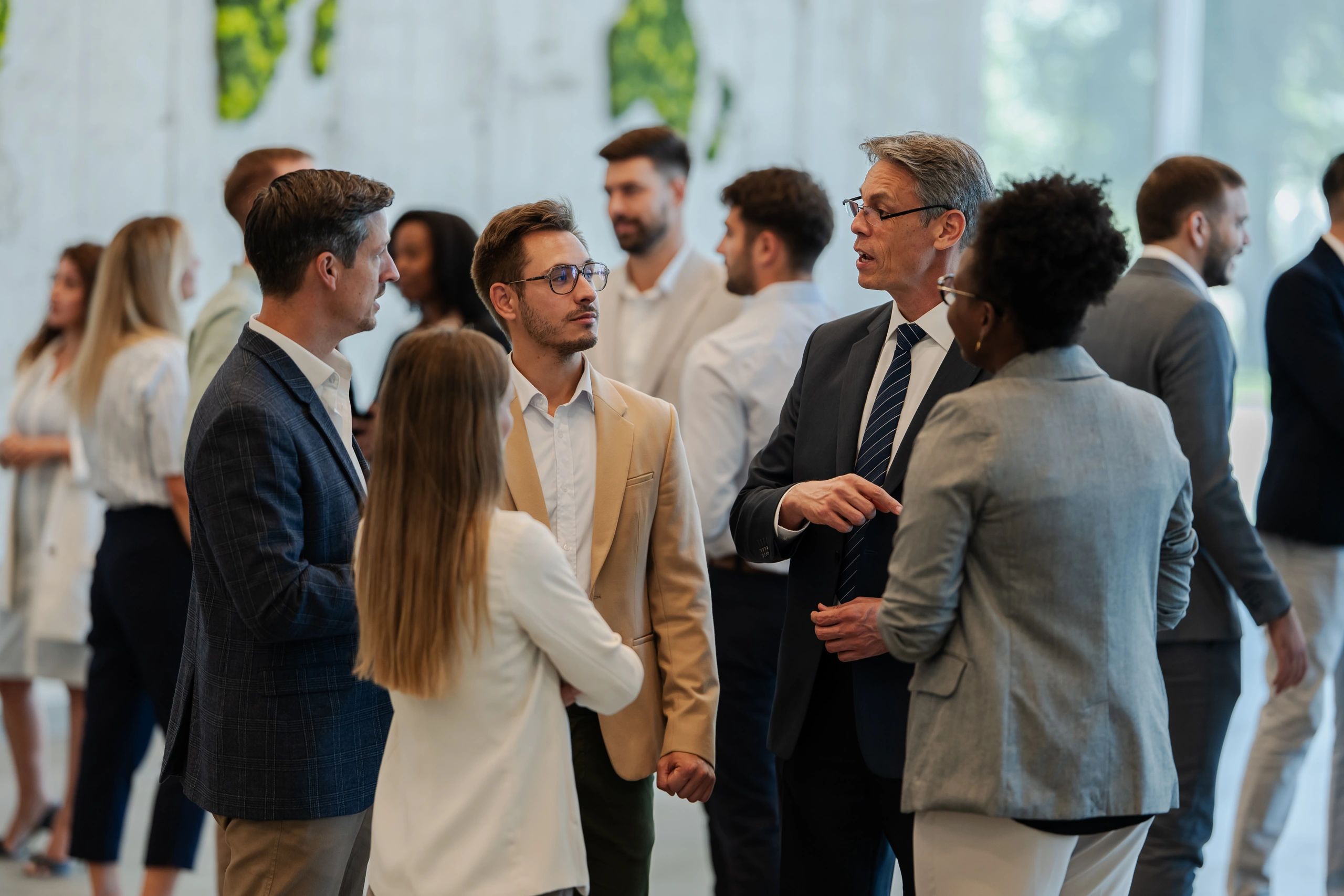 Professionals networking and exchanging ideas during a collaborative conference