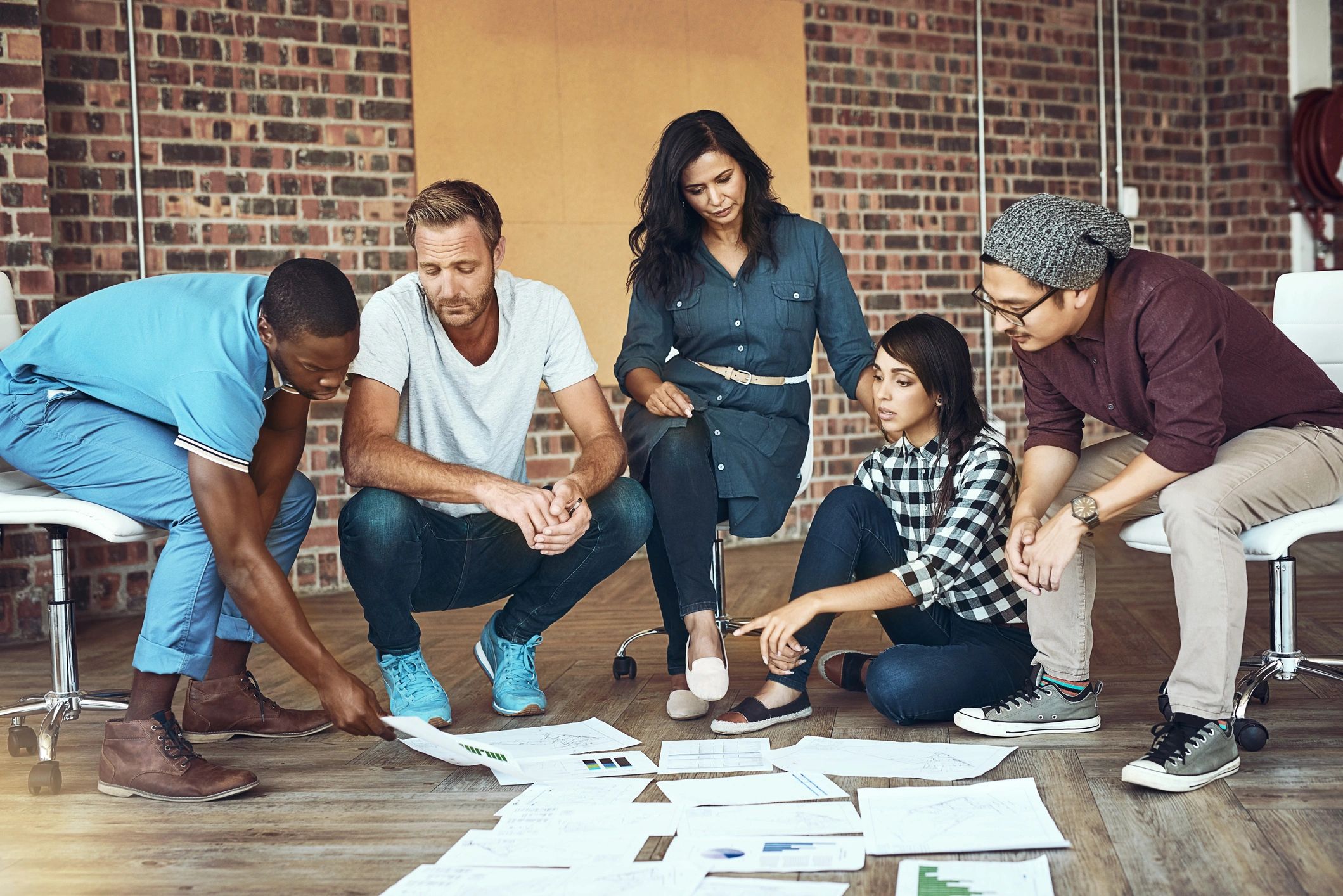 Team of entrepreneurs collaborating together in a modern workspace
