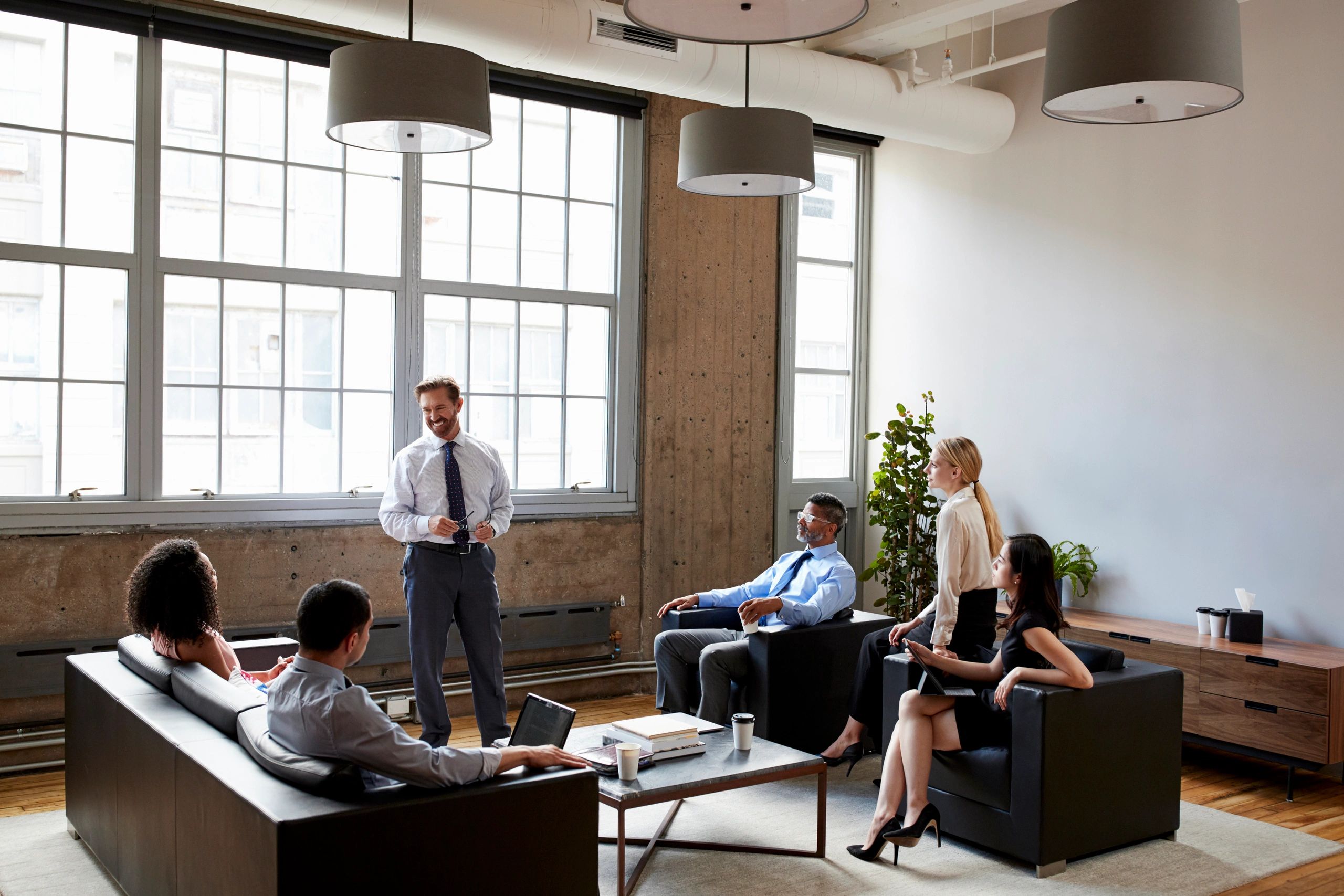 Presenter leading an informal business session with attendees